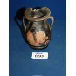 An Apulian red figure pottery vase, 4th century AD, painted with the head of a goddess, 4" tall,