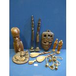 A quantity of Treen including African carved head, face mask, Lion plaque, Giraffe servers, bells,