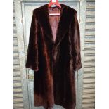 A vintage Martins of London fur coat, full length, brown beaver lamb and with original receipt .