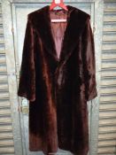 A vintage Martins of London fur coat, full length, brown beaver lamb and with original receipt .