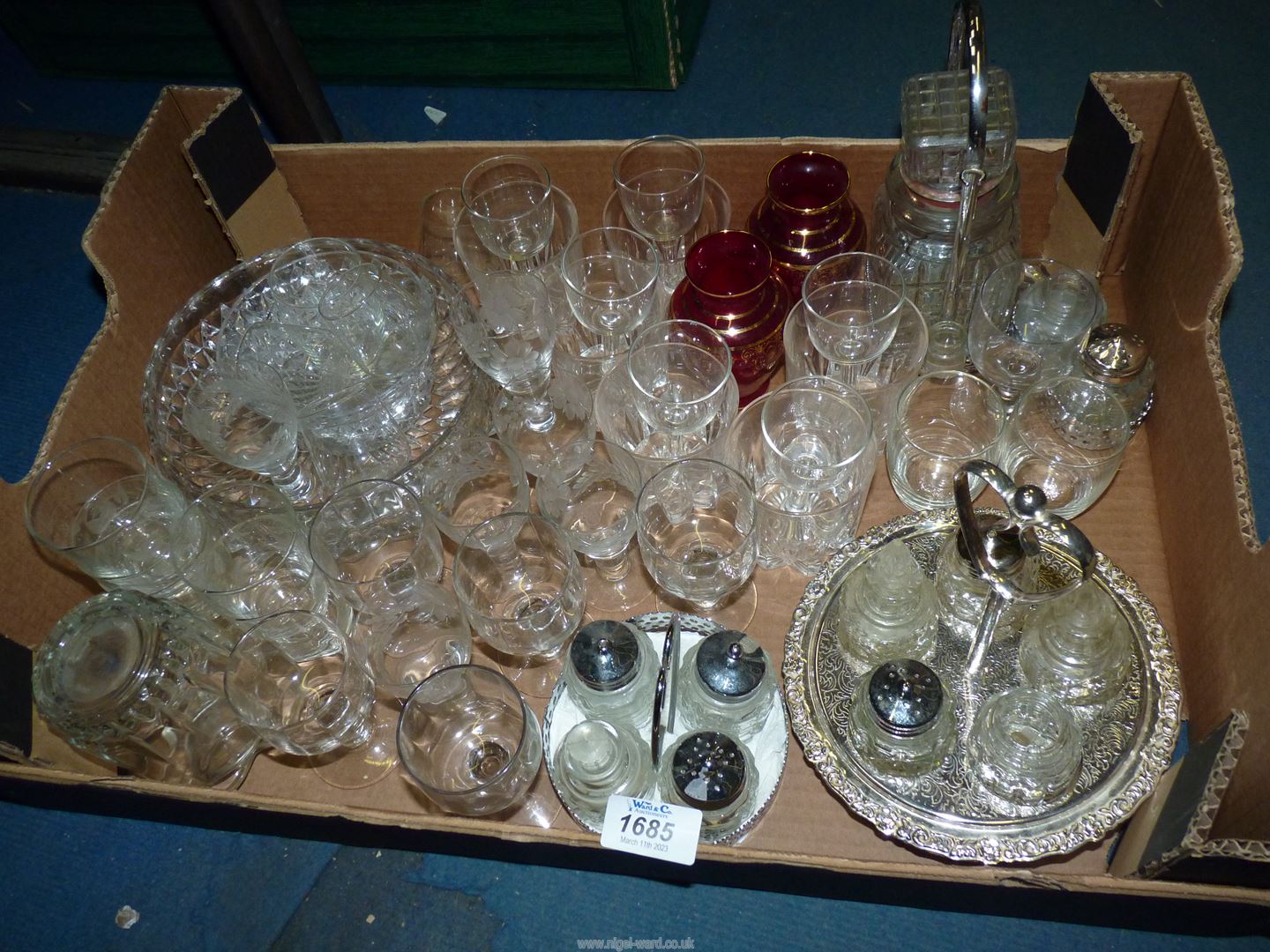 A box of mixed glass including cruet on trays, glasses, fruit bowl, etc.