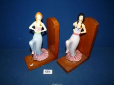 A pair of bookends with china Art Deco figures, a/f.
