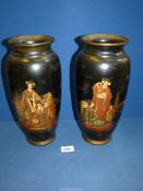 A Pair of oriental black lacquered vases having transfer print images of Japanese ladies holding