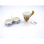 A pretty Meissen blue and white floral salt and pepper pots plus a continental miniature cup with