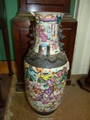 A large Chinese Cantonese vase painted with warriors, some damage.