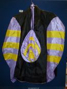 An Allerton & Co. Jockey silks in black with lilac and yellow sleeves, complete with cap, 40" chest.