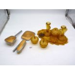 A pressed glass amber colour dressing table set, plus two brushes and a mirror.