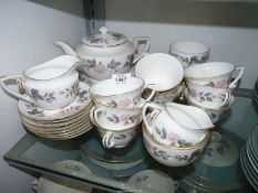 A Royal Worcester ''June Garland'' part Teaset including teapot, nine cups, eight saucers,