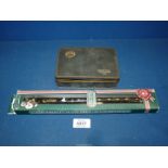 An original Clarke tin whistle in an unopened box and a vintage Players Cigarettes tin, black,