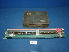 An original Clarke tin whistle in an unopened box and a vintage Players Cigarettes tin, black,