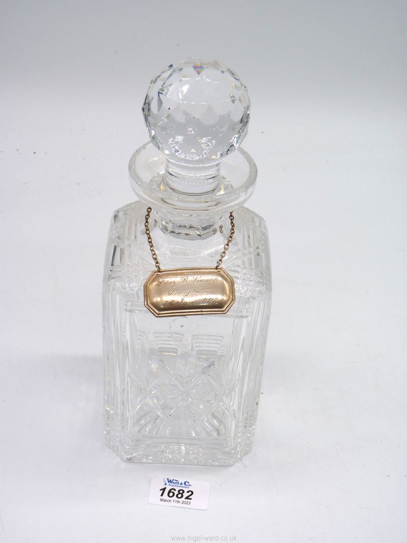 A cut glass Stuart Crystal square Decanter with stopper having a silver (Sheffield) decanter label