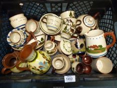 A quantity of Devon Ware china including cups, saucers, jugs, teapot etc.