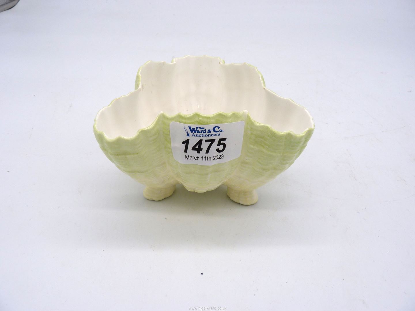 A Royal Worcester porcelain three-footed shell Bowl in green to cream gradient colour,
