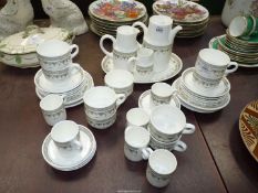 A quantity of white ground Wedgwood metallised tea and coffee ware plus oval platter in brown swag