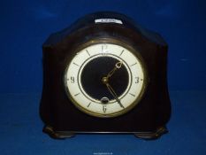 A Bakelite cased Smiths mantel clock 8 1/4" wide, 7 1/4" high. Key and pendulum present.