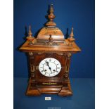 An attractive antique German Mantle clock in need of some restoration, 7" wide x 22" tall.
