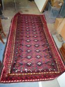 A Persian Blunchi nomadic full pile rug, 268cm x 138cm.