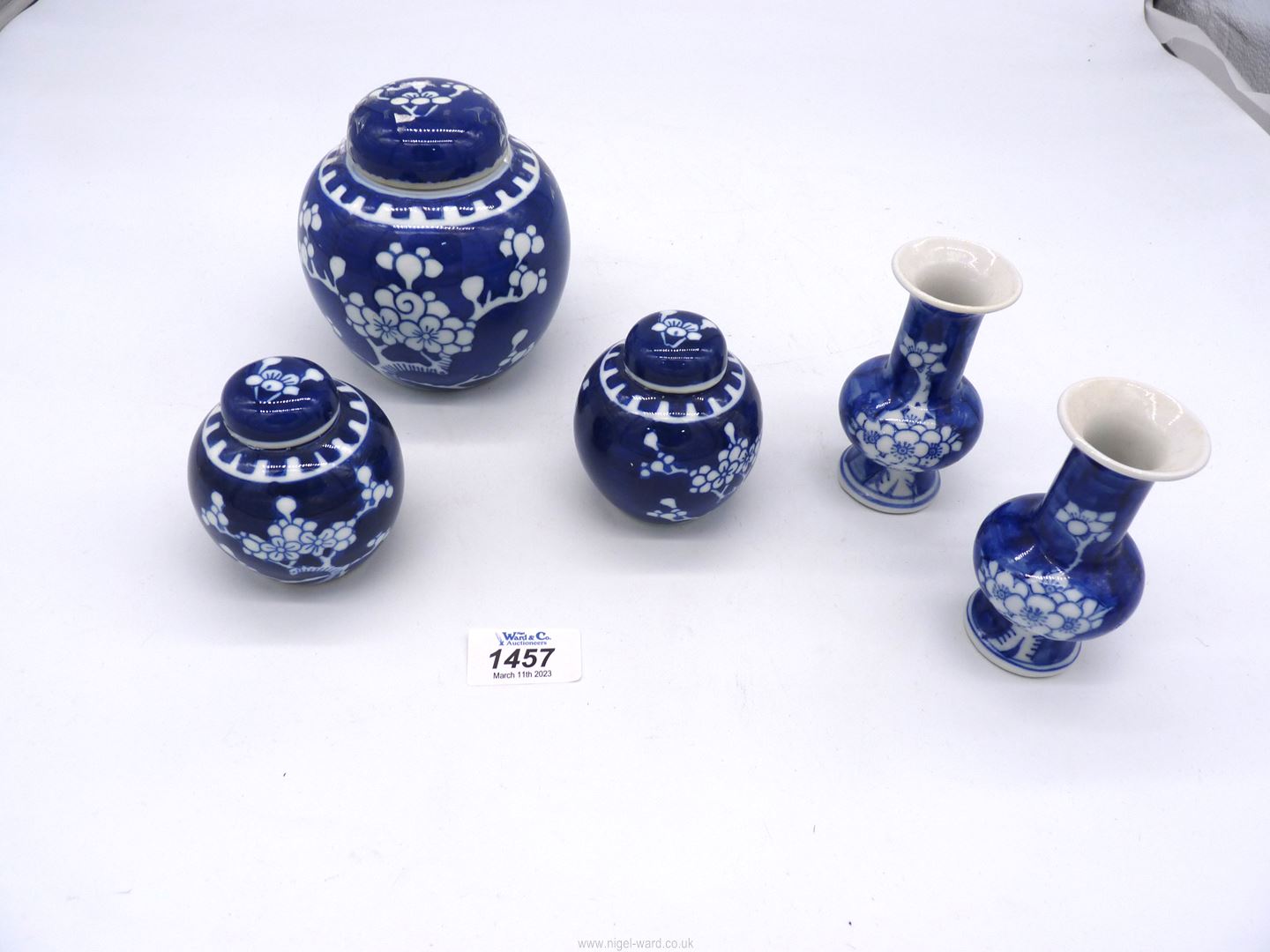 A pair of Chinese blue & white baluster shaped vases in prunus pattern,