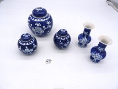 A pair of Chinese blue & white baluster shaped vases in prunus pattern,