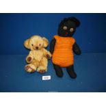 A Merrythorpe ''Little Bear'' with bells in his ears and a black fabric doll with orange knitted