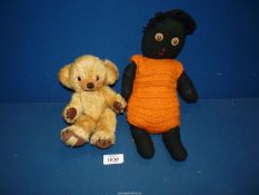 A Merrythorpe ''Little Bear'' with bells in his ears and a black fabric doll with orange knitted