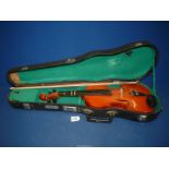 A cased Violin, made in China, 20 11/16'' long, the body 13'' long, together with a bow and resin.