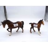 A Beswick Horse and Foal, both with leg repairs, tallest 6" high.