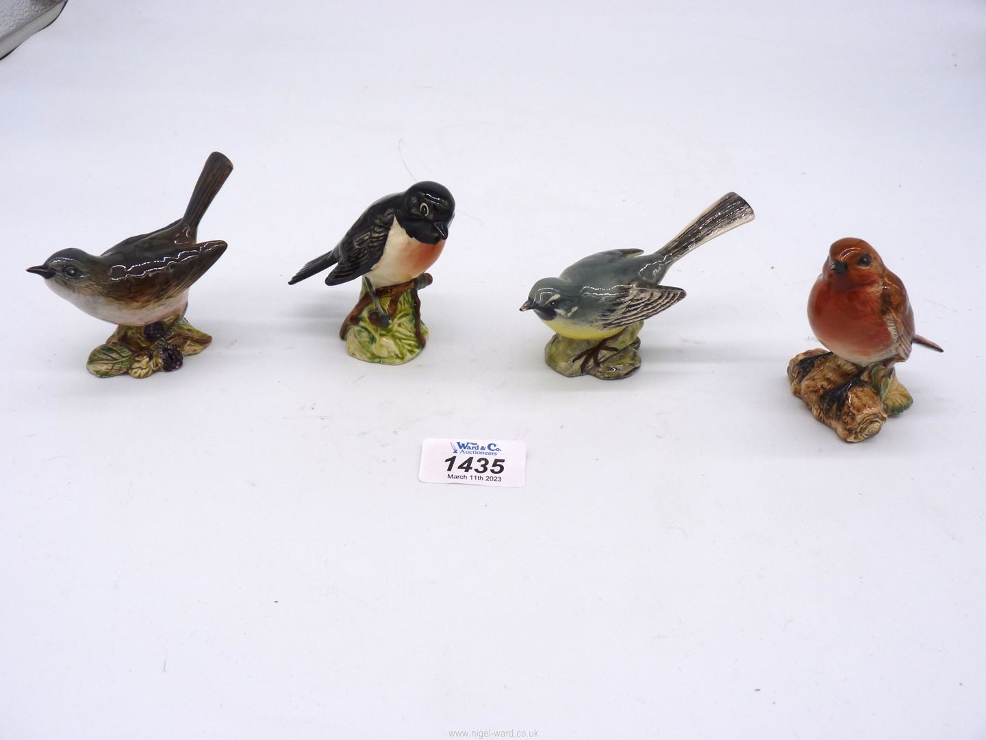 Four Beswick birds including Whitethroat, Grey Wagtail, Stonechat and Robin, all approx. 3" tall.