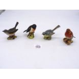 Four Beswick birds including Whitethroat, Grey Wagtail, Stonechat and Robin, all approx. 3" tall.