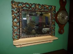 A beautifully carved giltwood framed wall hanging Mirror,