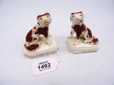 A pair of Staffordshire style miniature Mantle Spaniels, impressed 'W' to base, some small cracks,