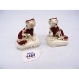 A pair of Staffordshire style miniature Mantle Spaniels, impressed 'W' to base, some small cracks,