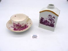 An 18th century Ludwigsburg cup and saucer decorated with purpurlanschaft (restoration to saucer)