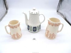An Alfred Meakin coffee pot and two Wedgwood Queens Ware jugs with pink relief.