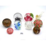 A quantity of mixed paperweights to include; Caithness 'Windfall' apple paperweight (stem missing),