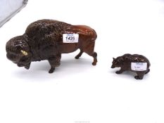 A Beswick Bison 9" long, leg and ear repaired and Beswick Brown Bear, good condition,