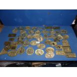 A quantity of vintage Rally plaques and horse brasses.
