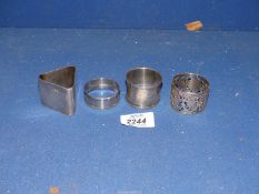 Four silver Napkin Rings, Birmingham, one in triangular form and one with pierced work decoration.
