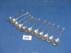 Eleven silver monogrammed teaspoons, Sheffield 1947, makers Duncan & Scobie, 139 grams.