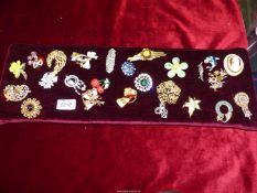 A large pad of Costume Brooches including enamelled, marcasite, glass stones etc.