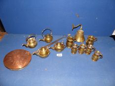 A copper Chestnut roaster together with miscellaneous brass jugs, small teapots, etc.