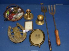 A quantity of brass including candlesticks, trivet,