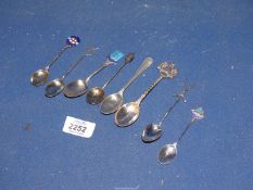 A quantity of silver spoons including coffee bean spoon, souvenir teaspoon etc.
