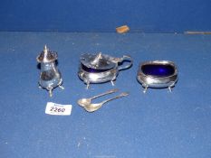 A silver Cruet, mustard and salt spoons, with blue glass liners, Sheffield 1929,