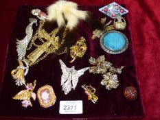 A pad of Costume Brooches including a large Crucifix pendant