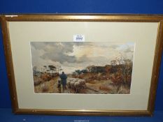 A framed and mounted Lithograph of a shepherd and his dog walking his sheep down a country lane,