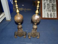 A pair of Fire dogs with brass finials.