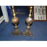 A pair of Fire dogs with brass finials.