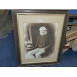 A large wooden framed print taken from a photograph of a seated gentleman, from The Vandyke Studio,