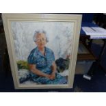 A large framed impasto portrait of an older lady in a blue dress sitting with her hands crossed on